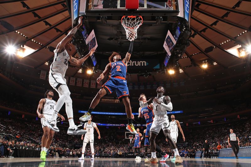 NEW YORK, NY - MARCH 23: Miles McBride #2 of the New York Knicks drives to the basket during the game against the Brooklyn Nets on March 23, 2024 at Madison Square Garden in New York City, New York.  NOTE TO USER: User expressly acknowledges and agrees that, by downloading and or using this photograph, User is consenting to the terms and conditions of the Getty Images License Agreement. Mandatory Copyright Notice: Copyright 2024 NBAE  (Photo by Nathaniel S. Butler/NBAE via Getty Images)