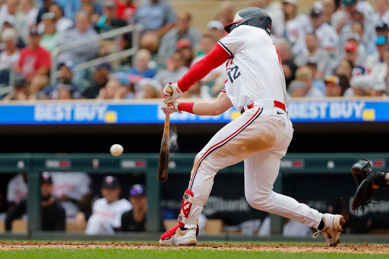 Sep 9, 2023; Minneapolis, Minnesota, USA; Minnesota Twins third baseman Kyle Farmer (12) hits an RBI double against the New York Mets in the seventh inning at Target Field. Mandatory Credit: Bruce Kluckhohn-USA TODAY Sports