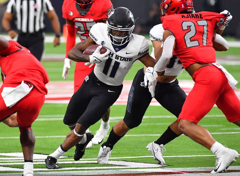 Oct 16, 2021; Paradise, Nevada, USA;  Utah State Aggies wide receiver Savon Scarver (11) runs after making a reception against the UNLV Rebels at Allegiant Stadium. Mandatory Credit: Stephen R. Sylvanie-USA TODAY Sports