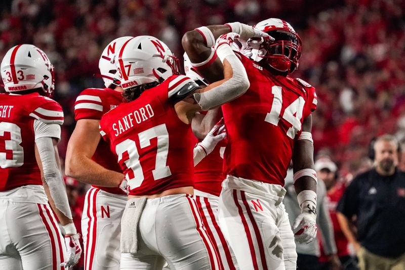 Sep 16, 2023; Lincoln, Nebraska, USA; Nebraska Cornhuskers linebacker Chief Borders (14) celebrates after a stop against the Northern Illinois Huskies during the fourth quarter at Memorial Stadium. Mandatory Credit: Dylan Widger-USA TODAY Sports