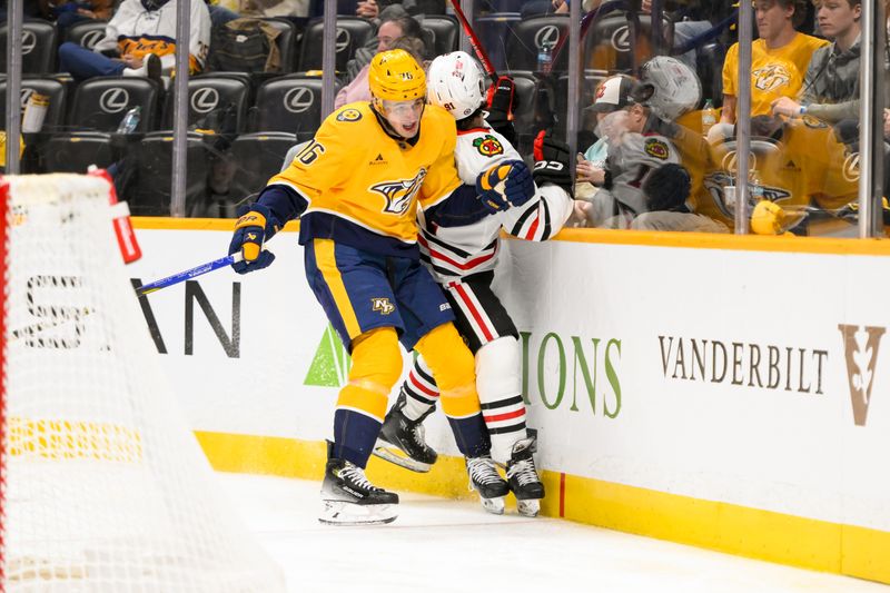 Jan 16, 2025; Nashville, Tennessee, USA;  Nashville Predators defenseman Brady Skjei (76) checks Chicago Blackhawks center Frank Nazar (91) into the boards during the second period at Bridgestone Arena. Mandatory Credit: Steve Roberts-Imagn Images