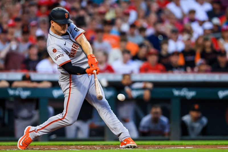 Aug 2, 2024; Cincinnati, Ohio, USA; San Francisco Giants third baseman Matt Chapman (26) hits a single against the Cincinnati Reds in the first inning at Great American Ball Park. Mandatory Credit: Katie Stratman-USA TODAY Sports