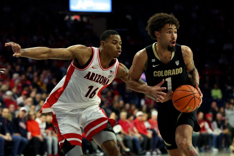 Jan 4, 2024; Tucson, Arizona, USA; Colorado Buffaloes guard J'Vonne Hadley (1) drives to the net against Arizona Wildcats forward Keshad Johnson (16) during the first half at McKale Center. Mandatory Credit: Zachary BonDurant-USA TODAY Sports