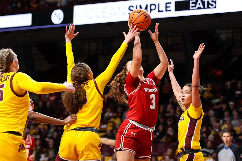 Feb 20, 2024; Minneapolis, Minnesota, USA; Wisconsin Badgers guard Brooke Schramek (3) shoots as Minnesota Golden Gophers guard Amaya Battle (3) defends during the second half at Williams Arena. Mandatory Credit: Matt Krohn-USA TODAY Sports