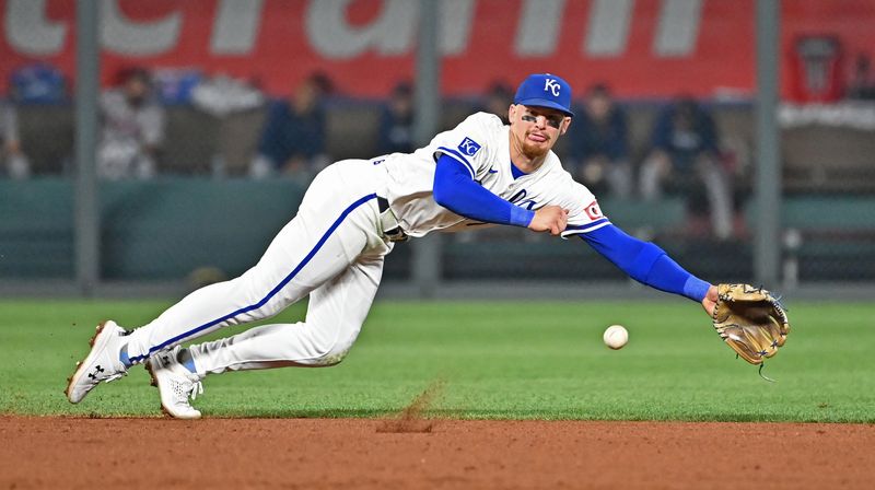 Aug 5, 2024; Kansas City, Missouri, USA;  Kansas City Royals shortstop Bobby Witt Jr. (7) dives for a ground ball hit by Boston Red Sox Ceddanne Rafaela (not pictured) in the seventh inning at Kauffman Stadium. Mandatory Credit: Peter Aiken-USA TODAY Sports