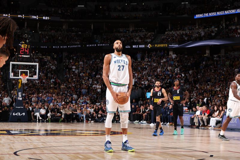 DENVER, CO - MAY 19: Rudy Gobert #27 of the Minnesota Timberwolves shoots a free throw during the game  against the Denver Nuggets during Round 2 Game 7 of the 2024 NBA Playoffs on May 19, 2024 at the Ball Arena in Denver, Colorado. NOTE TO USER: User expressly acknowledges and agrees that, by downloading and/or using this Photograph, user is consenting to the terms and conditions of the Getty Images License Agreement. Mandatory Copyright Notice: Copyright 2023 NBAE (Photo by David Sherman/NBAE via Getty Images)