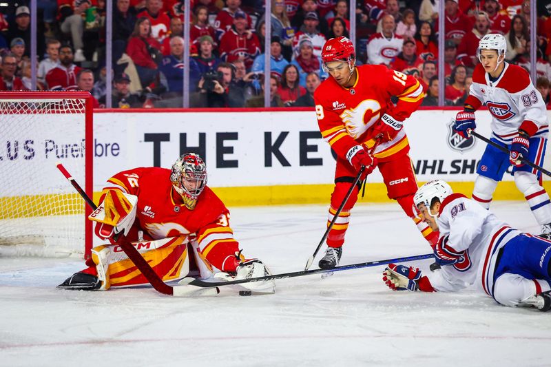 Oct 22, 2025; Calgary, Alberta, CAN; Calgary Flames goaltender Dustin Wolf (32) makes a save against Montreal Canadiens center Oliver Kapanen (91) during the first period at Scotiabank Saddledome. Mandatory Credit: Sergei Belski-Imagn Images