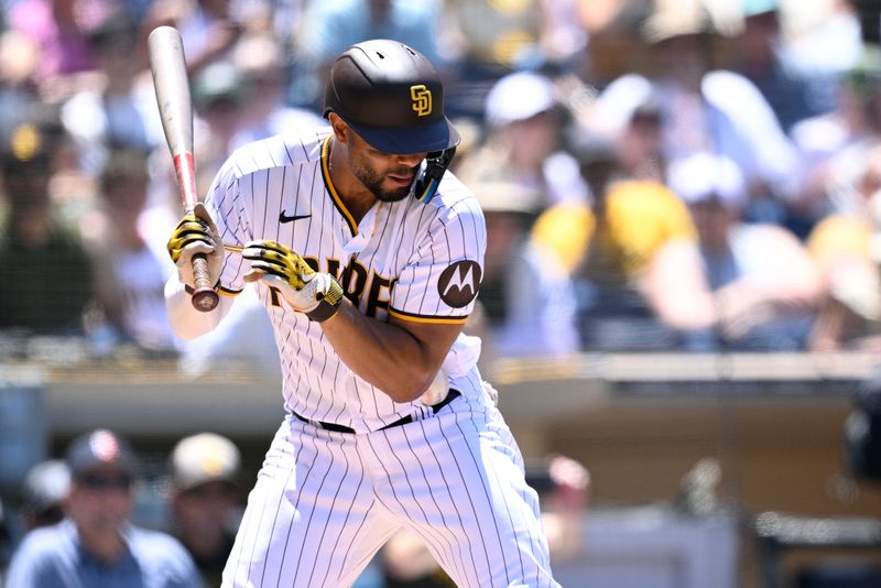 Jul 26, 2023; San Diego, California, USA; San Diego Padres shortstop Xander Bogaerts (2) is hit by a pitch during the third inning against the Pittsburgh Pirates at Petco Park. Mandatory Credit: Orlando Ramirez-USA TODAY Sports