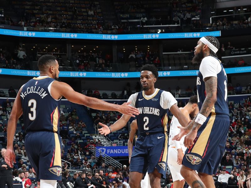 NEW ORLEANS, LA - DECEMBER 5: Herbert Jones #2 and CJ McCollum #3 of the New Orleans Pelicans high five during the game against the Phoenix Suns during the game on December 5, 2024 at the Smoothie King Center in New Orleans, Louisiana. NOTE TO USER: User expressly acknowledges and agrees that, by downloading and or using this Photograph, user is consenting to the terms and conditions of the Getty Images License Agreement. Mandatory Copyright Notice: Copyright 2024 NBAE (Photo by Layne Murdoch Jr./NBAE via Getty Images)