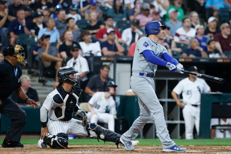 Jun 25, 2024; Chicago, Illinois, USA; Los Angeles Dodgers first baseman Freddie Freeman (5) hits a two-run home run against the Chicago White Sox during the third inning at Guaranteed Rate Field. Mandatory Credit: Kamil Krzaczynski-USA TODAY Sports