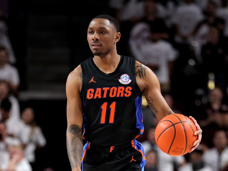 Jan 18, 2023; College Station, Texas, USA; Florida Gators guard Kyle Lofton (11) handles the ball against the Texas A&M Aggies during the first half at Reed Arena. Mandatory Credit: Erik Williams-USA TODAY Sports
