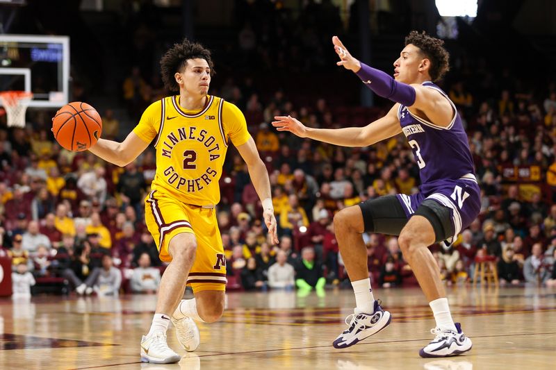 Feb 3, 2024; Minneapolis, Minnesota, USA; Minnesota Golden Gophers guard Mike Mitchell Jr. (2) passes as Northwestern Wildcats guard Ty Berry (3) defends during the first half at Williams Arena. Mandatory Credit: Matt Krohn-USA TODAY Sports