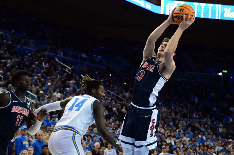 Mar 4, 2023; Los Angeles, California, USA;  Arizona Wildcats guard Pelle Larsson (3) shoots the ball during the first half against UCLA Bruins forward Kenneth Nwuba (14) at Pauley Pavilion presented by Wescom. Mandatory Credit: Richard Mackson-USA TODAY Sports