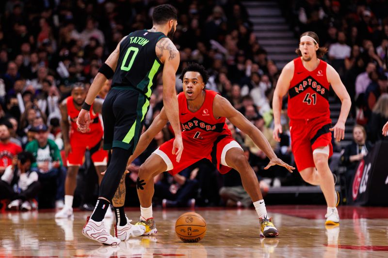 TORONTO, CANADA - JANUARY 15: Scottie Barnes #4 of the Toronto Raptors defends against Jayson Tatum #0 of the Boston Celtics during second half of their NBA game at Scotiabank Arena on January 15, 2025 in Toronto, Canada. NOTE TO USER: User expressly acknowledges and agrees that, by downloading and or using this photograph, User is consenting to the terms and conditions of the Getty Images License Agreement. (Photo by Cole Burston/Getty Images)