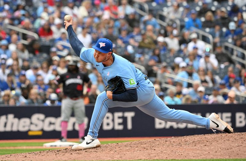 May 12, 2024; Toronto, Ontario, CAN;  Toronto Blue Jays relief pitcher Nate Pearson (24) delivers a pitch against the Minnesota Twins in the ninth inning at Rogers Centre. Mandatory Credit: Dan Hamilton-USA TODAY Sports