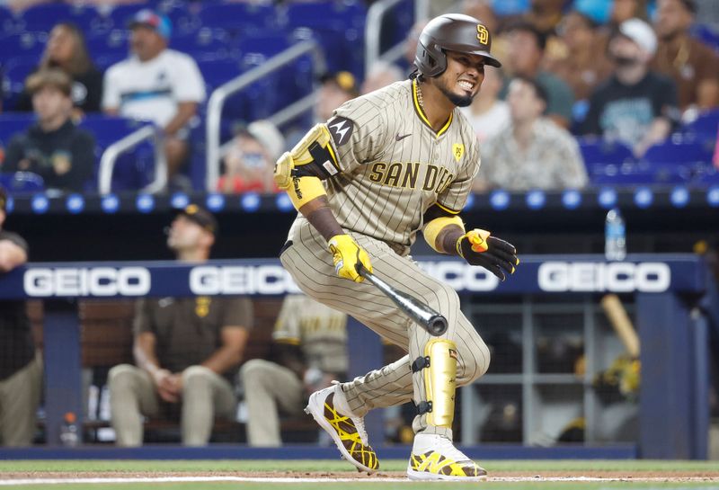 Aug 9, 2024; Miami, Florida, USA;  San Diego Padres designated hitter Luis Arraez (4) reacts against the Miami Marlins in the first inning at loanDepot Park. Mandatory Credit: Rhona Wise-USA TODAY Sports