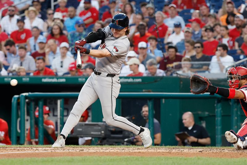 Jun 18, 2024; Washington, District of Columbia, USA; Arizona Diamondbacks outfielder Jake McCarthy (31) singles against the Washington Nationals during the sixth inning at Nationals Park. Mandatory Credit: Geoff Burke-USA TODAY Sports