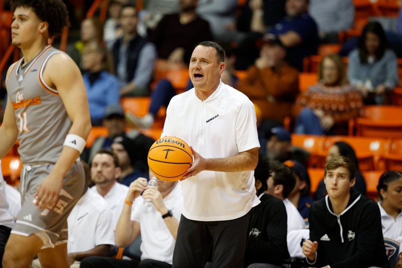 Feb 3, 2024; El Paso, Texas, USA; UTEP Miners head coach Joe Golding  holds the game in the first half against  the Liberty University Flames  at Don Haskins Center. Mandatory Credit: Ivan Pierre Aguirre-USA TODAY Sports