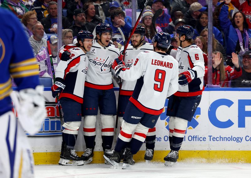 Nov 1, 2025; Buffalo, New York, USA;  Washington Capitals center Dylan Strome (17) celebrates his goal with teammates during the first period against the Buffalo Sabres at KeyBank Center. Mandatory Credit: Timothy T. Ludwig-Imagn Images
