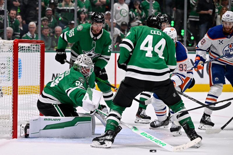 May 21, 2025; Dallas, Texas, USA; Dallas Stars goaltender Jake Oettinger (29) makes a save against the Edmonton Oilers in the third period during game one of the Western Conference Final of the 2025 Stanley Cup Playoffs at American Airlines Center. Mandatory Credit: Jerome Miron-Imagn Images