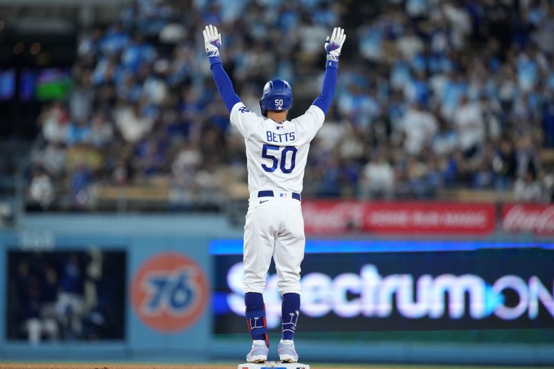 Sep 20, 2023; Los Angeles, California, USA; Los Angeles Dodgers second baseman Mookie Betts (50) gestures after hitting a double in the eighth inning against the Detroit Tigers at Dodger Stadium. Mandatory Credit: Kirby Lee-USA TODAY Sports