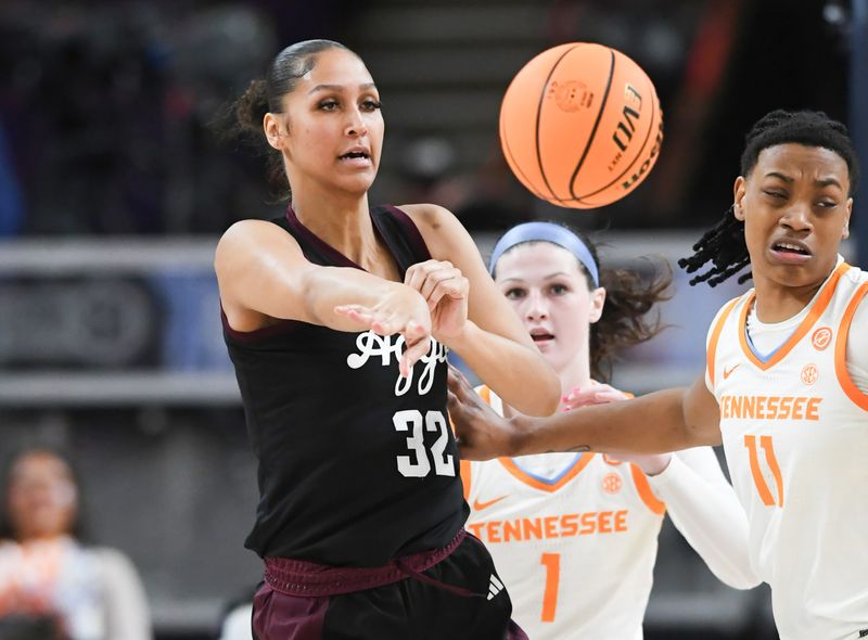 Mar 5, 2025; Greenville, South Carolina, USA; Texas A&M forward Lauren Ware (32) passes near Tennessee forward Zee Spearman (11) during the first quarter of the Southeastern Conference Women's Basketball Tournament at Bon Secours Wellness Arena.  Mandatory Credit: Ken Ruinard/USA TODAY NETWORK via Imagn Images