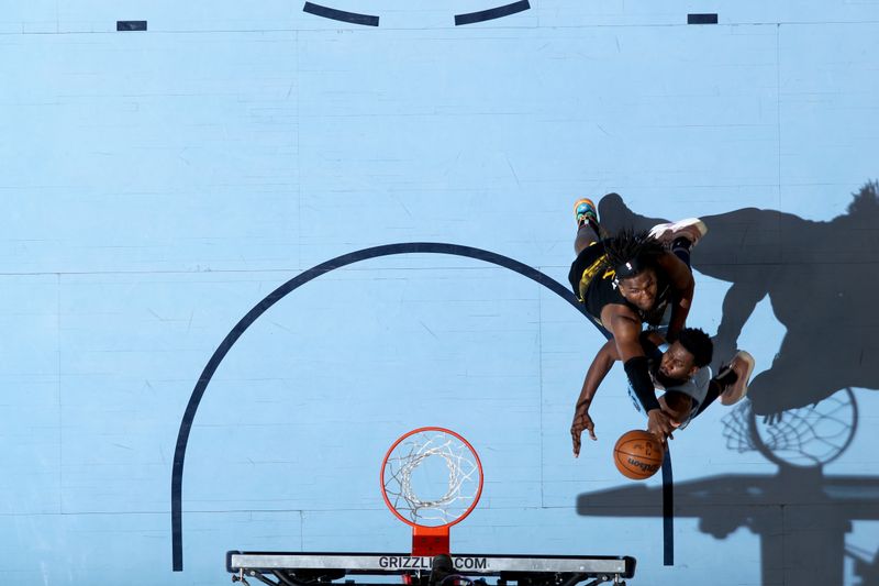 MEMPHIS, TN - MARCH 18: Jaren Jackson Jr. #13 of the Memphis Grizzlies drives to the basket during the game against the Golden State Warriors on March 18, 2023 at FedExForum in Memphis, Tennessee. NOTE TO USER: User expressly acknowledges and agrees that, by downloading and or using this photograph, User is consenting to the terms and conditions of the Getty Images License Agreement. Mandatory Copyright Notice: Copyright 2023 NBAE (Photo by Joe Murphy/NBAE via Getty Images)