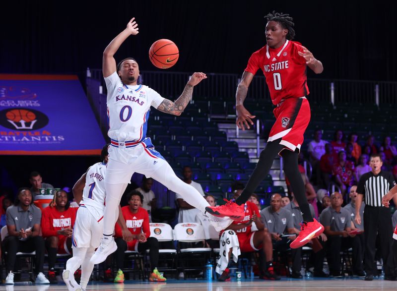 Nov 23, 2022; Paradise Island, BAHAMAS; North Carolina State Wolfpack guard Terquavion Smith (0) blocks the shot of Kansas Jayhawks guard Bobby Pettiford Jr. (0) during the first half at Imperial Arena. Mandatory Credit: Kevin Jairaj-USA TODAY Sports