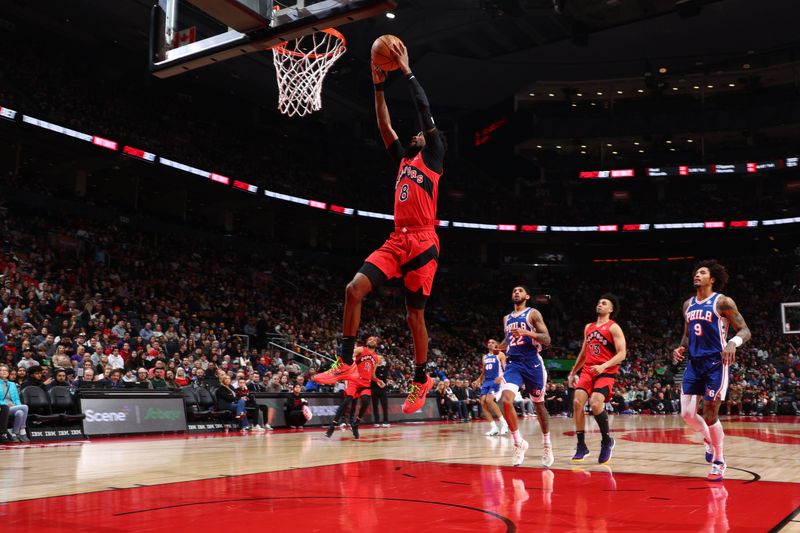 TORONTO, CANADA - MARCH 31: Kobi Simmons #8 of the Toronto Raptors drives to the basket during the game against the Philadelphia 76ers on March 31, 2024 at the Scotiabank Arena in Toronto, Ontario, Canada.  NOTE TO USER: User expressly acknowledges and agrees that, by downloading and or using this Photograph, user is consenting to the terms and conditions of the Getty Images License Agreement.  Mandatory Copyright Notice: Copyright 2024 NBAE (Photo by Vaughn Ridley/NBAE via Getty Images)