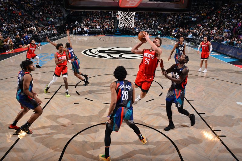 BROOKLYN, NY - JANUARY 27: Alperen Sengun #28 of the Houston Rockets drives to the basket during the game against the Brooklyn Nets on January 27, 2024 at Barclays Center in Brooklyn, New York. NOTE TO USER: User expressly acknowledges and agrees that, by downloading and or using this Photograph, user is consenting to the terms and conditions of the Getty Images License Agreement. Mandatory Copyright Notice: Copyright 2024 NBAE (Photo by Jesse D. Garrabrant/NBAE via Getty Images)