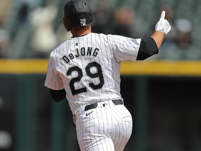 Apr 17, 2024; Chicago, Illinois, USA; Chicago White Sox shortstop Paul DeJong (29) raises his hand after hitting a two run home run in the second inning during game one of a double header against the Kansas City Royals at Guaranteed Rate Field. Mandatory Credit: Melissa Tamez-USA TODAY Sports