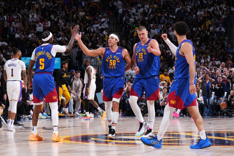 DENVER, CO - APRIL 20: The Denver Nuggets celebrates during the game against the Los Angeles Lakers during Round 1 Game 1 of the 2024 NBA Playoffs on April 20, 2024 at the Ball Arena in Denver, Colorado. NOTE TO USER: User expressly acknowledges and agrees that, by downloading and/or using this Photograph, user is consenting to the terms and conditions of the Getty Images License Agreement. Mandatory Copyright Notice: Copyright 2024 NBAE (Photo by Garrett Ellwood/NBAE via Getty Images)