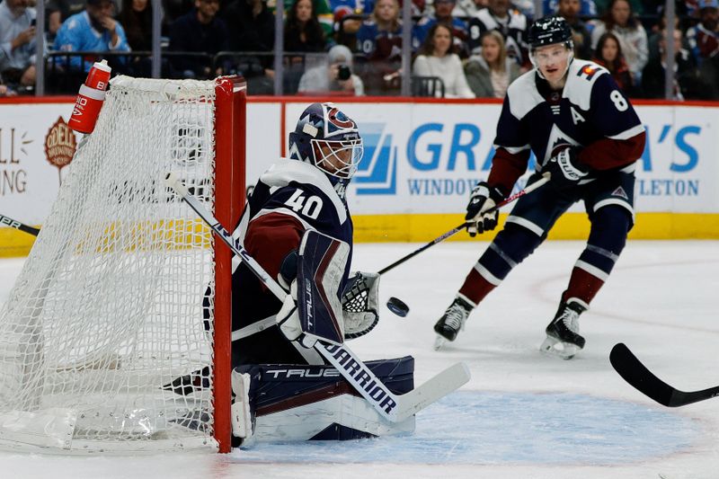 Apr 9, 2024; Denver, Colorado, USA; Colorado Avalanche goaltender Alexandar Georgiev (40) deflects a shot in the first period against the Minnesota Wild at Ball Arena. Mandatory Credit: Isaiah J. Downing-USA TODAY Sports