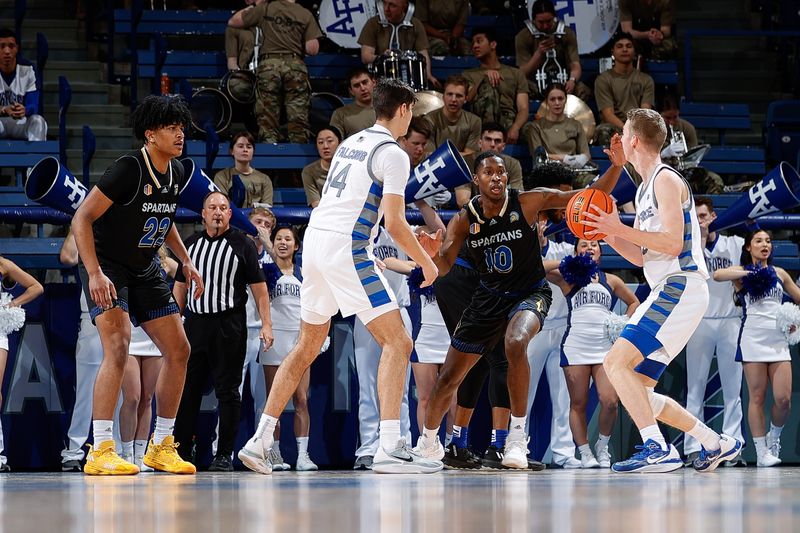 Mar 4, 2023; Colorado Springs, Colorado, USA; Air Force Falcons guard Jake Heidbreder (3) controls the ball against San Jose State Spartans guard Omari Moore (10) as forward Beau Becker (14) and forward Robert Vaihola (22) defend in the first half at Clune Arena. Mandatory Credit: Isaiah J. Downing-USA TODAY Sports