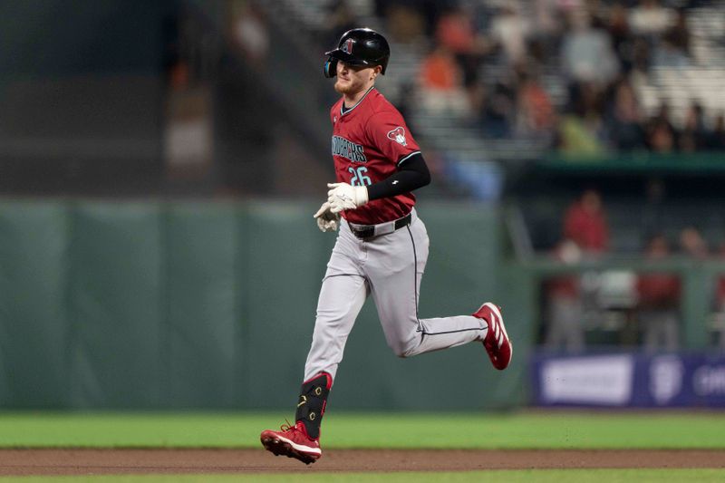 Sep 4, 2024; San Francisco, California, USA;  Arizona Diamondbacks outfielder Pavin Smith (26) runs the bases after hitting a solo home run during the fifth inning against the San Francisco Giants at Oracle Park. Mandatory Credit: Stan Szeto-Imagn Images