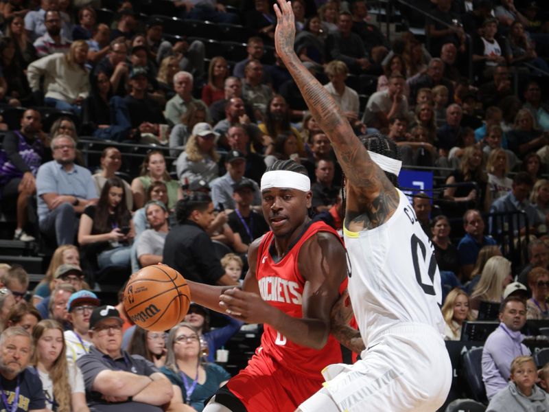 SALT LAKE CITY, UT - OCTOBER 7: Aaron Holiday #0 of the Houston Rockets drives to the basket during the game against the Utah Jazz during a NBA preseason game on October 7, 2024 at the Delta Center in Salt Lake City, Utah. NOTE TO USER: User expressly acknowledges and agrees that, by downloading and or using this Photograph, User is consenting to the terms and conditions of the Getty Images License Agreement. Mandatory Copyright Notice: Copyright 2024 NBAE (Photo by Melissa Majchrzak/NBAE via Getty Images)