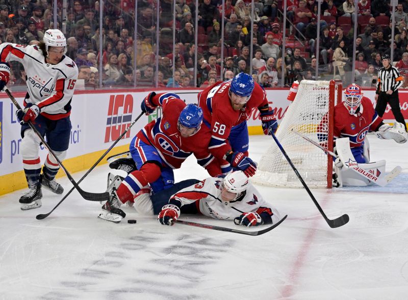 Feb 17, 2024; Montreal, Quebec, CAN; Montreal Canadiens defenseman Jayden Struble (47) and teammate  defenseman David Savard (58) fall on Washington Capitals forward Michael Sgarbossa (23) during the first period at the Bell Centre. Mandatory Credit: Eric Bolte-USA TODAY Sports