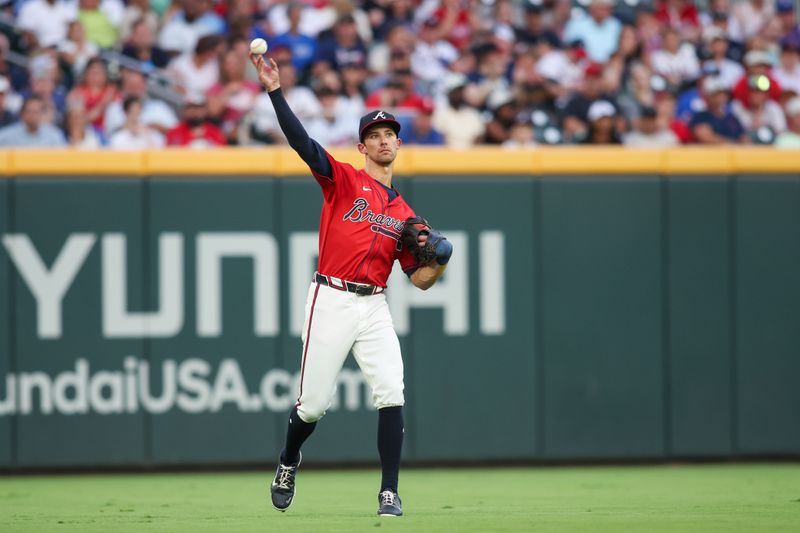 Jul 5, 2024; Atlanta, Georgia, USA; Atlanta Braves center fielder Eli White (36) throws the ball against the Philadelphia Phillies in the fourth inning at Truist Park. Mandatory Credit: Brett Davis-USA TODAY Sports
