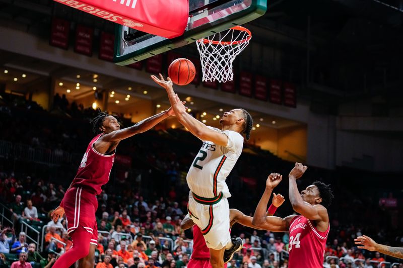 Feb 11, 2023; Coral Gables, Florida, USA; Miami (Fl) Hurricanes guard Isaiah Wong (2) shoots against the Louisville Cardinals during the second half at Watsco Center. Mandatory Credit: Rich Storry-USA TODAY Sports