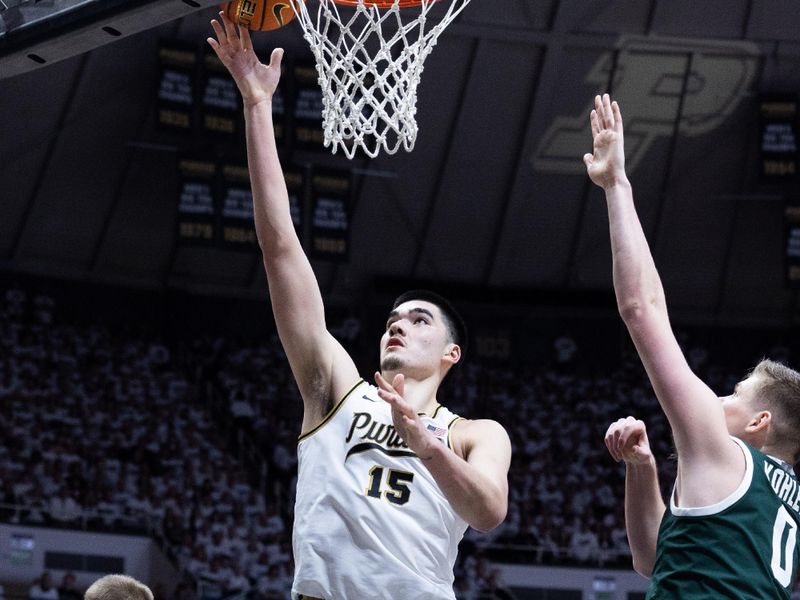 Jan 29, 2023; West Lafayette, Indiana, USA; Purdue Boilermakers center Zach Edey (15) shoots the ball while Michigan State Spartans forward Jaxon Kohler (0) defends in the second half at Mackey Arena. Mandatory Credit: Trevor Ruszkowski-USA TODAY Sports