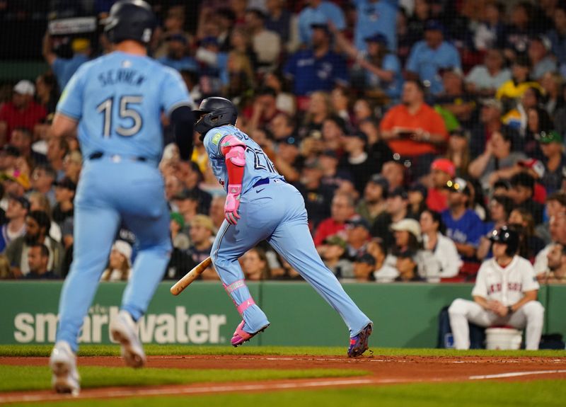 Aug 29, 2024; Boston, Massachusetts, USA; Toronto Blue Jays designated hitter Vladimir Guerrero Jr. (27) hits a double to drive in a run against the Boston Red Sox  in the third inning at Fenway Park. Mandatory Credit: David Butler II-USA TODAY Sports