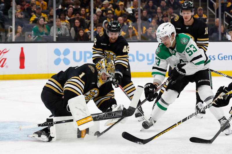 Feb 19, 2024; Boston, Massachusetts, USA; Dallas Stars center Wyatt Johnston (53) tries to jam a rebound past Boston Bruins goaltender Jeremy Swayman (1) during the second period at TD Garden. Mandatory Credit: Winslow Townson-USA TODAY Sports