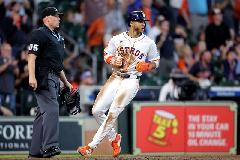 May 28, 2025; Houston, Texas, USA; Houston Astros shortstop Jeremy Pena (3) crosses home plate to score a run against the Athletics during the seventh inning at Daikin Park. Mandatory Credit: Erik Williams-Imagn Images
