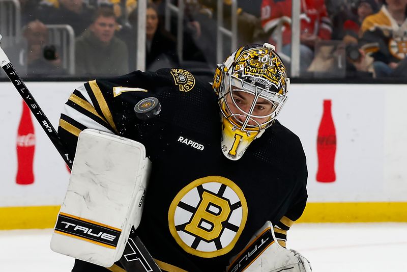 Jan 15, 2024; Boston, Massachusetts, USA; Boston Bruins goaltender Jeremy Swayman (1) makes a shoulder save against the New Jersey Devils during the second period at TD Garden. Mandatory Credit: Winslow Townson-USA TODAY Sports