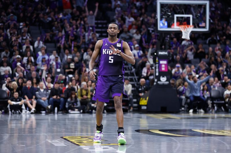 SACRAMENTO, CALIFORNIA - NOVEMBER 15: De'Aaron Fox #5 of the Sacramento Kings reacts after making a three-point basket in overtime against the Minnesota Timberwolves during the Emirates NBA Cup game at Golden 1 Center on November 15, 2024 in Sacramento, California. NOTE TO USER: User expressly acknowledges and agrees that, by downloading and or using this photograph, User is consenting to the terms and conditions of the Getty Images License Agreement (Photo by Lachlan Cunningham/Getty Images)