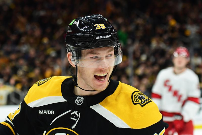 Apr 5, 2025; Boston, Massachusetts, USA; Boston Bruins center Morgan Geekie (39) reacts after scoring a goal during the first period against the Carolina Hurricanes at TD Garden. Mandatory Credit: Bob DeChiara-Imagn Images