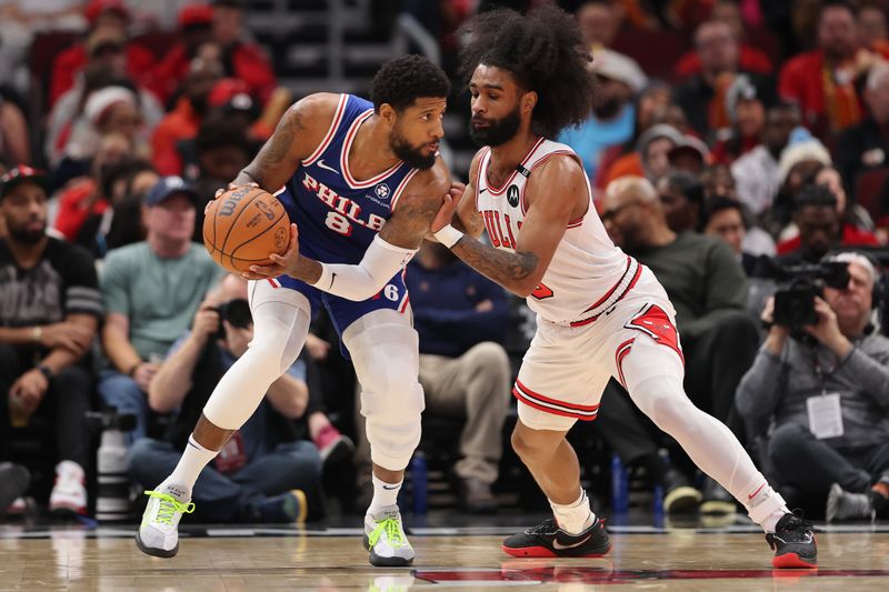 CHICAGO, ILLINOIS - DECEMBER 08: Paul George #8 of the Philadelphia 76ers is defended by Coby White #0 of the Chicago Bulls during the second half at the United Center on December 08, 2024 in Chicago, Illinois. NOTE TO USER: User expressly acknowledges and agrees that, by downloading and or using this photograph, User is consenting to the terms and conditions of the Getty Images License Agreement.  (Photo by Michael Reaves/Getty Images)