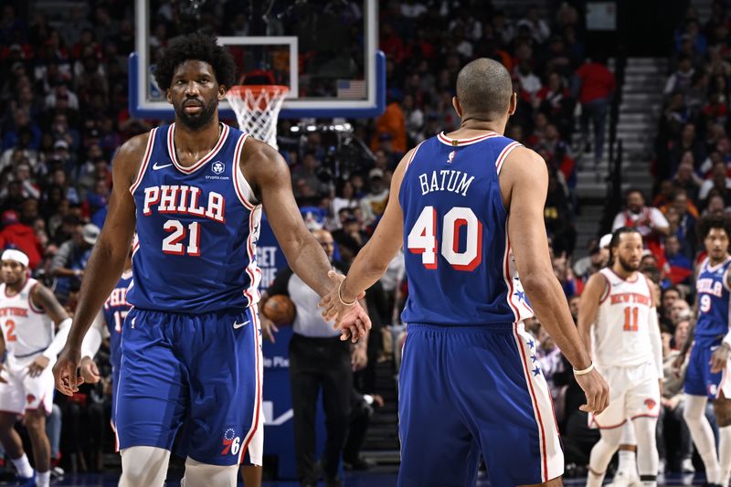 PHILADELPHIA, PA - APRIL 25: Joel Embiid #21 high fives Nicolas Batum #40 of the Philadelphia 76ers during the game against the New York Knicks during Round 1 Game 3 of the 2024 NBA Playoffs on April 25, 2024 at the Wells Fargo Center in Philadelphia, Pennsylvania NOTE TO USER: User expressly acknowledges and agrees that, by downloading and/or using this Photograph, user is consenting to the terms and conditions of the Getty Images License Agreement. Mandatory Copyright Notice: Copyright 2024 NBAE (Photo by David Dow/NBAE via Getty Images)