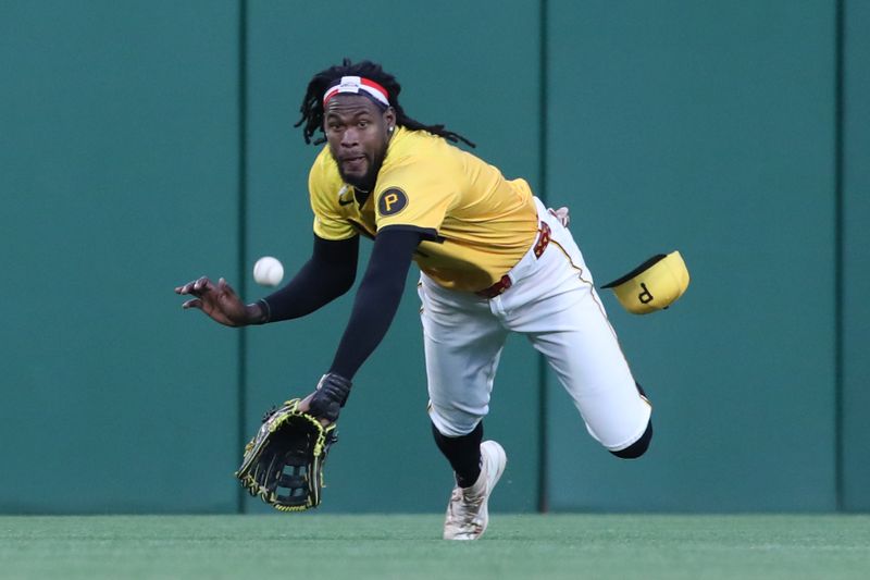 May 23, 2025; Pittsburgh, Pennsylvania, USA;  Pittsburgh Pirates center fielder Oneil Cruz (15) dives but fails to catch a ball hit for an RBI single by Milwaukee Brewers first baseman Rhys Hoskins (not pictured) during the sixth inning at PNC Park. Mandatory Credit: Charles LeClaire-Imagn Images