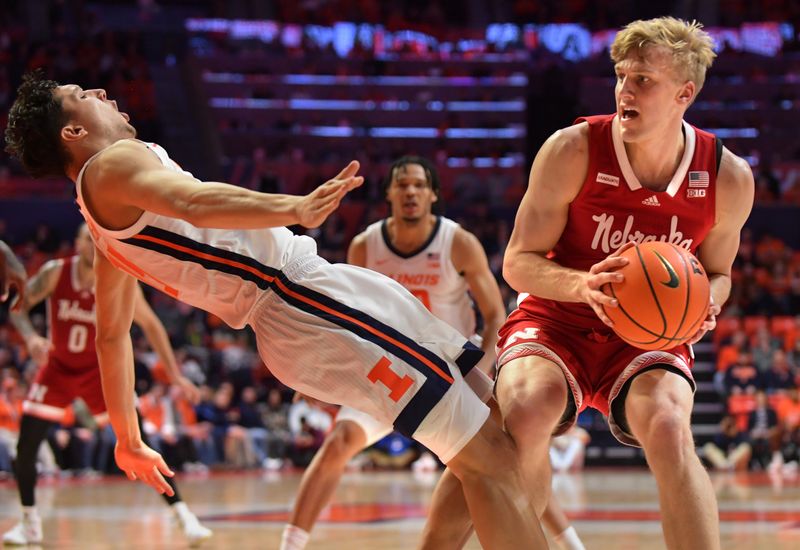 Jan 31, 2023; Champaign, Illinois, USA; Illinois Fighting Illini guard RJ Melendez (15) draws a charging call on Nebraska Cornhuskers guard Sam Griesel (5) during the second half at State Farm Center. Mandatory Credit: Ron Johnson-USA TODAY Sports